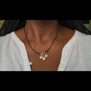 3 pearl necklace on a leather code necklace